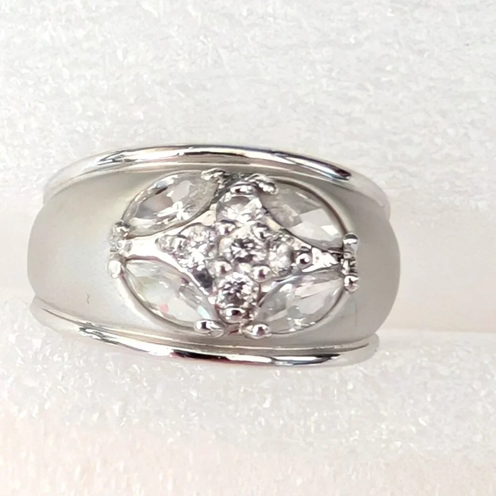 Matte brushed silver tone and faux diamond wide band ring